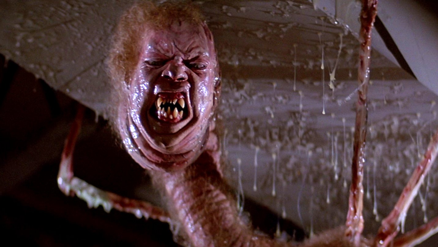 At the end of The Thing (1982) when MacReady and Childs were sitting down  when the camp was burning down, was one of them infected? Was it convenient  for the “Thing” because