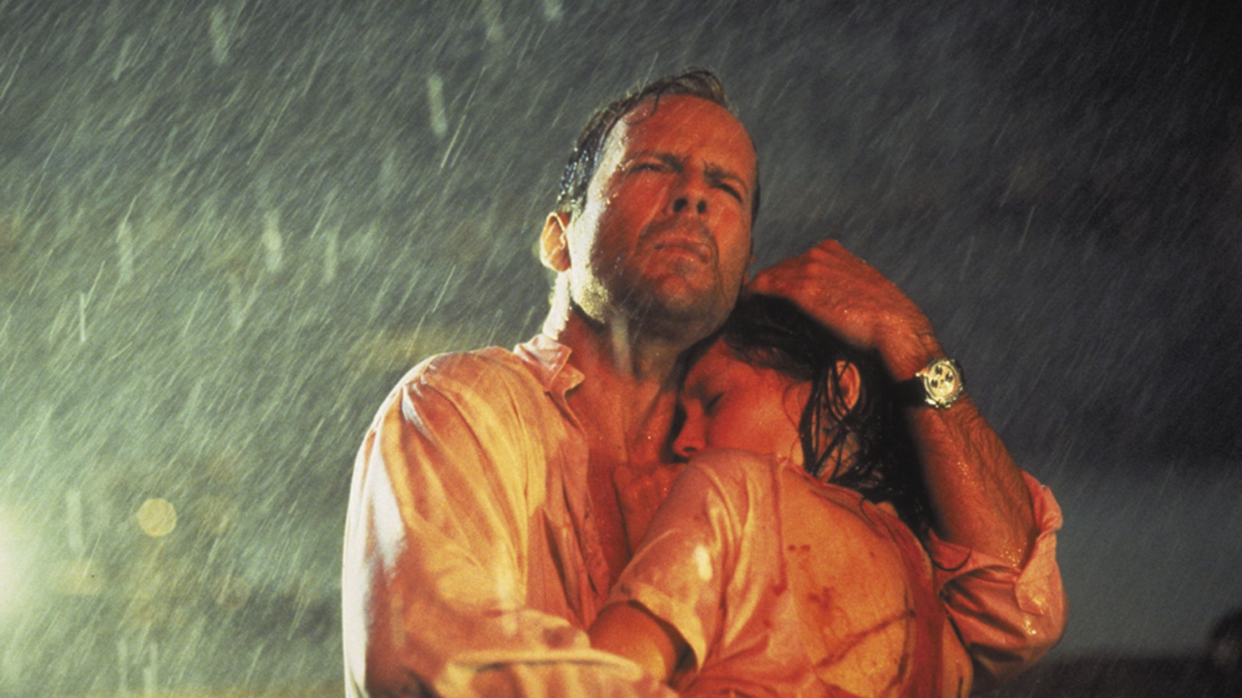 Bruce Willis holds Jane Marsh in the rain