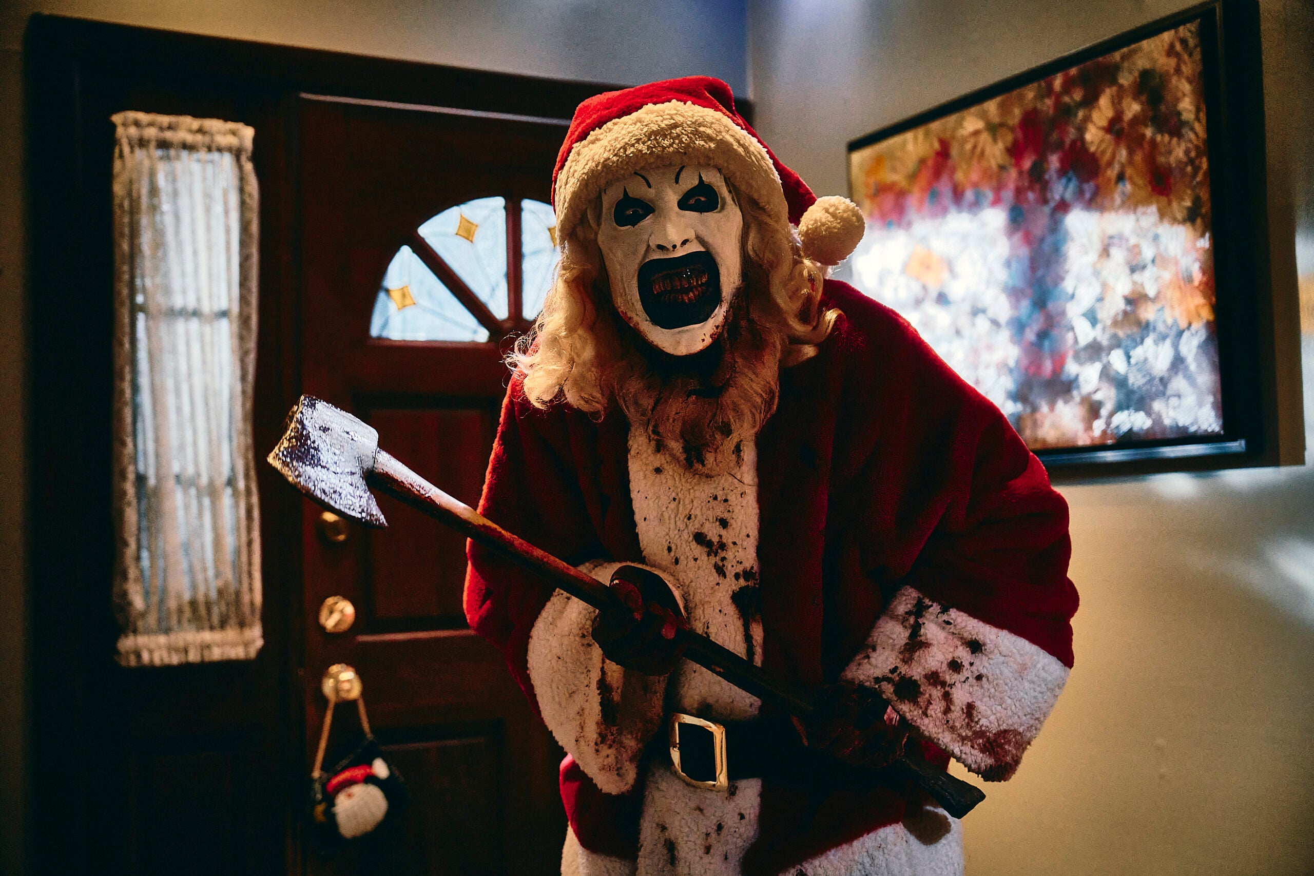 Art the Clown Prepares to Chop Down More Than a Christmas Tree in New ‘Terrifier 3’ Image