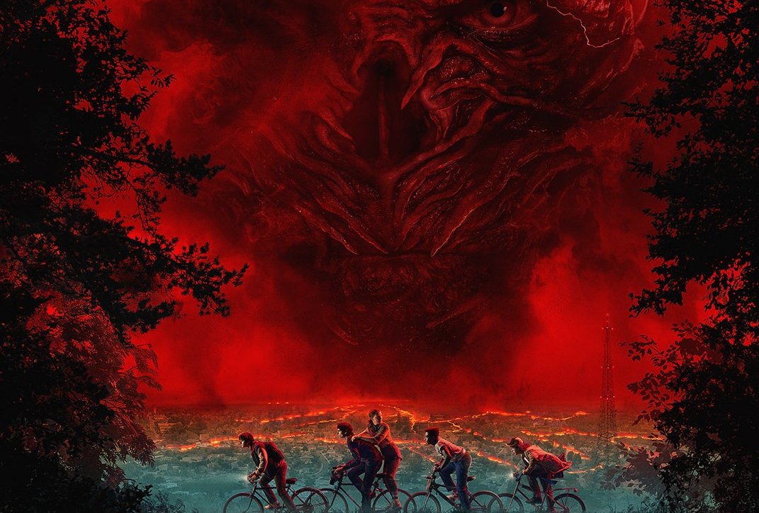 Picture of Dustin, Mike, Lucas, Will, and Eleven riding bicycles in the middle of a red storm. One looks ominously behind them.