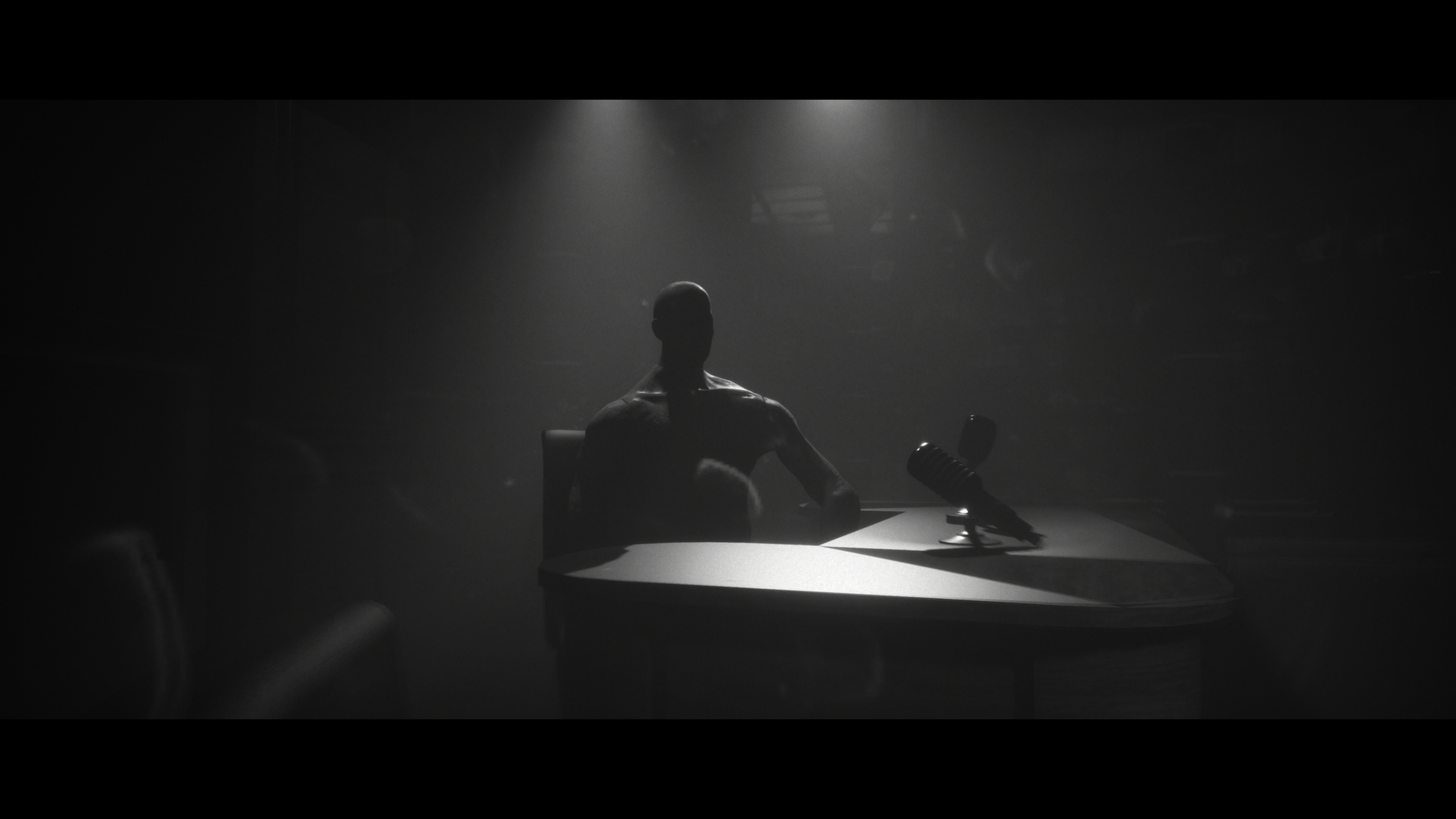Project Songbird interview- creepy shadow man sits at desk under glaring lights in very dark room