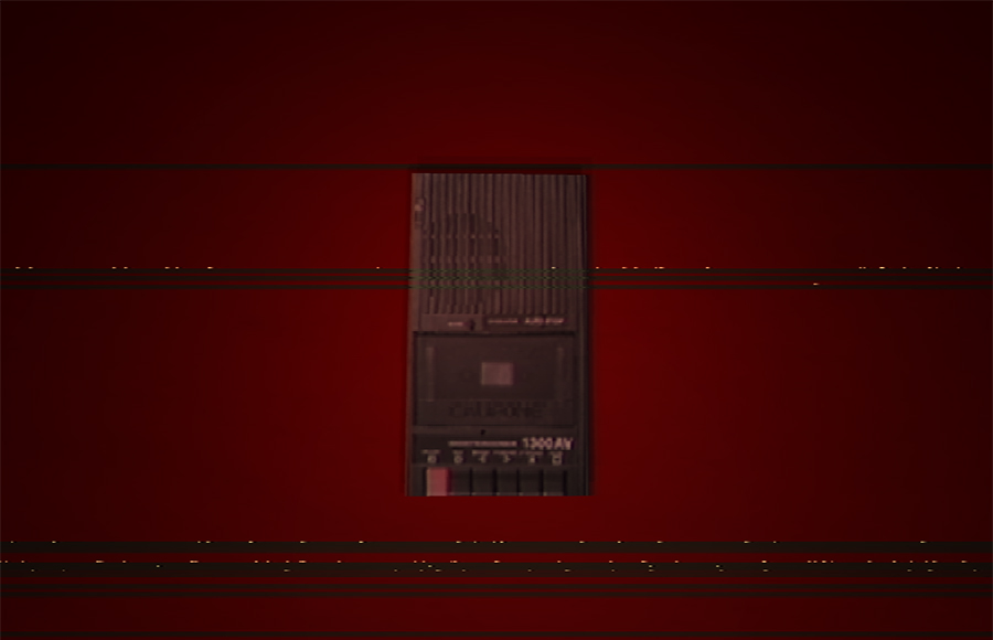 Anatomy retrospective- eerie tape recorder on red table