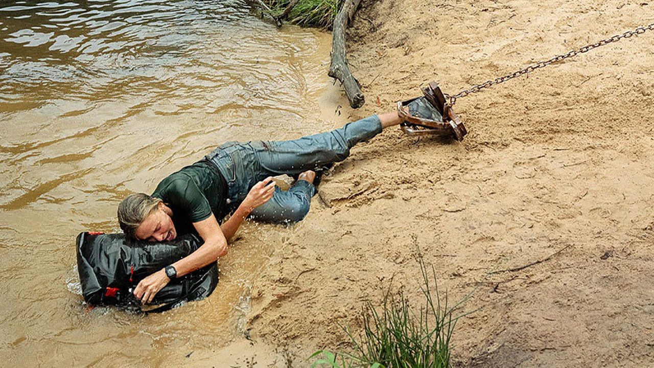 Taron Egerton Catches Charlize Theron in a Bear Trap in New 'Apex' Images - Bloody Disgusting